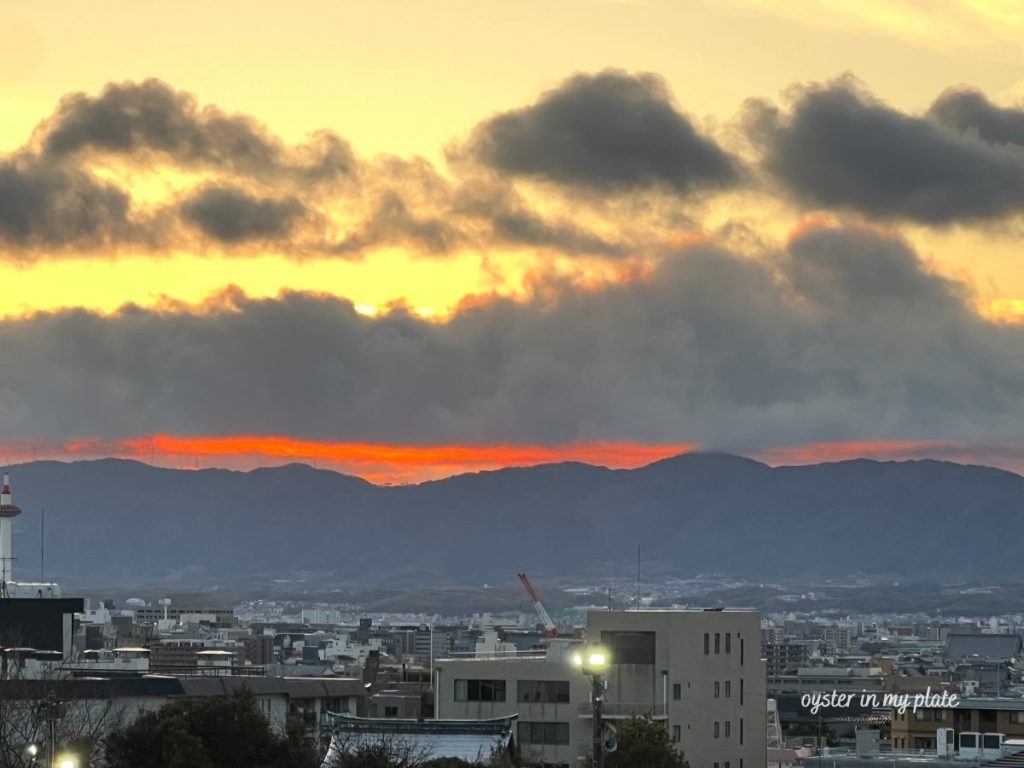 View of Kyoto from Kiyomizu-dera, with beautiful natural surroundings and the traditional cityscape blending sunset together.